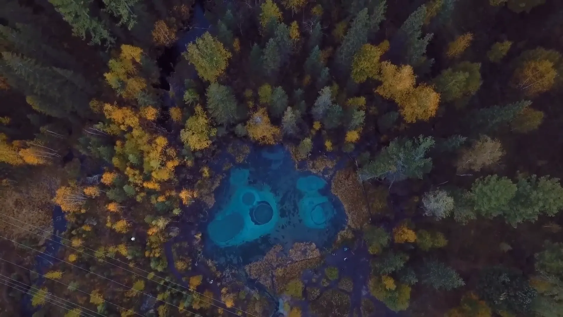 The enchanting Geyser Lake with its turquoise waters